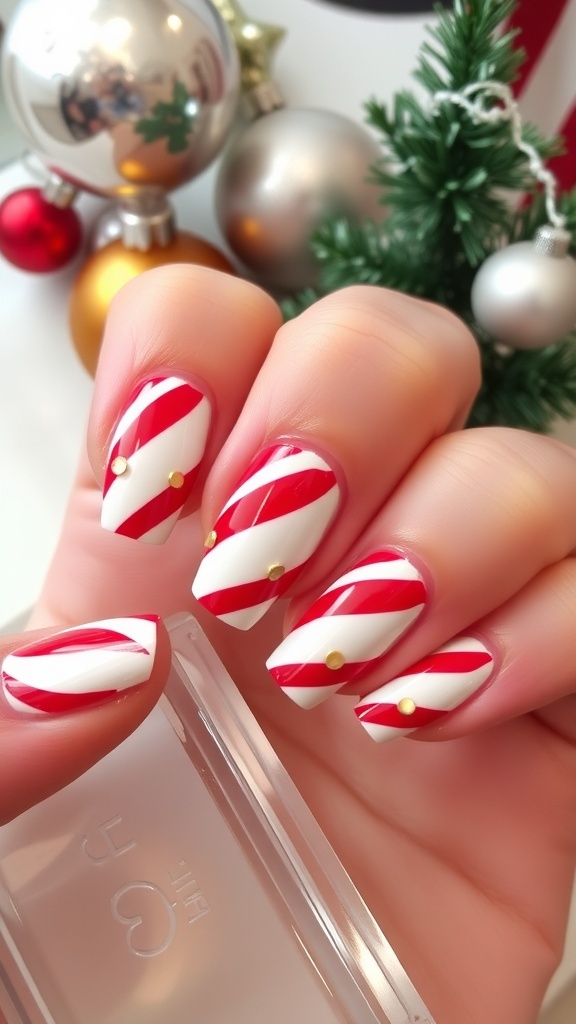 Close-up of candy cane nail art with red and white stripes on a festive background.